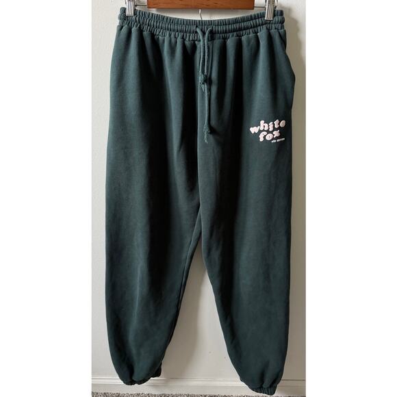 White Fox Pants - White Fox green joggers with light pink writing women's medium